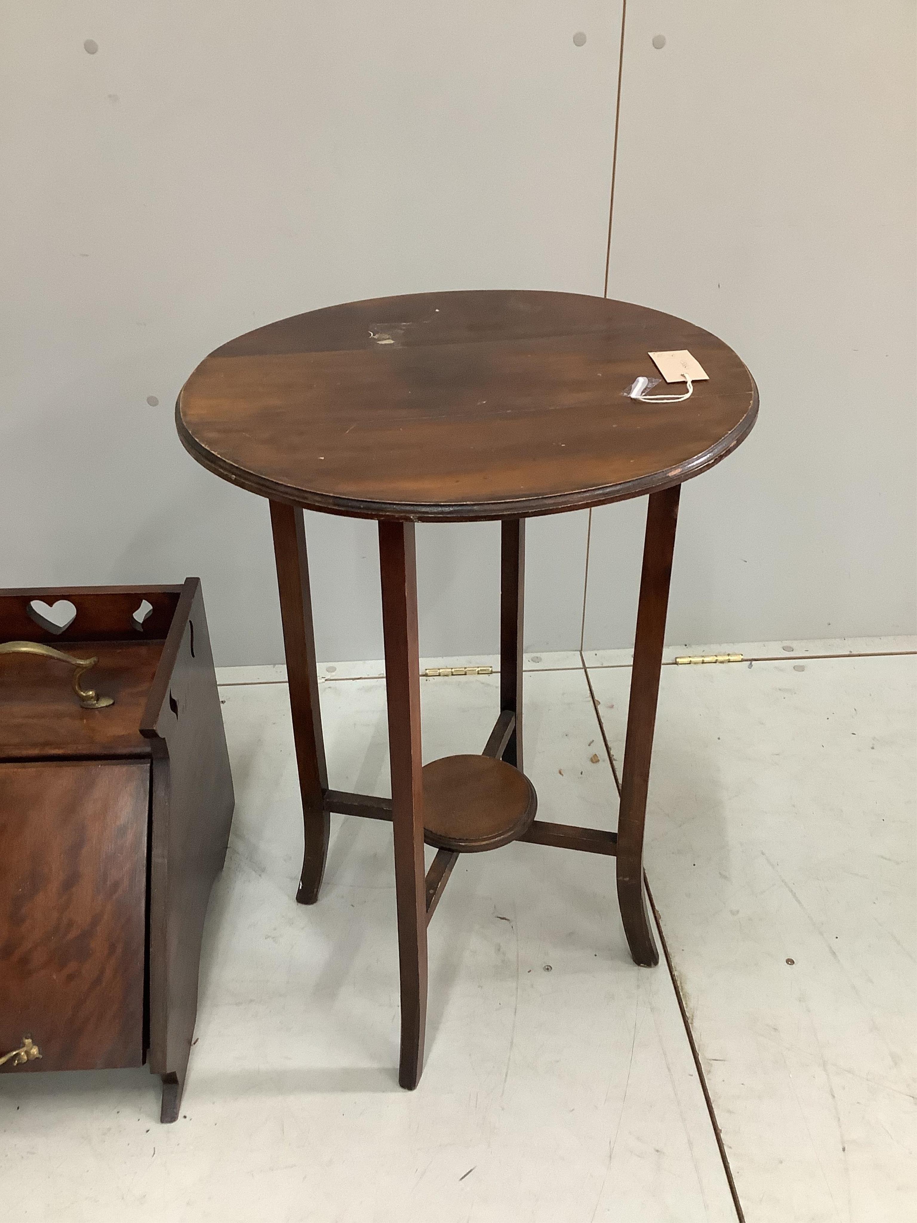 A Victorian circular adjustable piano stool, a late Victorian coal scuttle and an Edwardian drop flap occasional table. Condition - fair